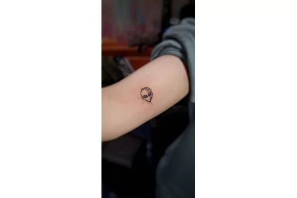Premium Vector  Hand drawn minimalist tattoo astronaut design